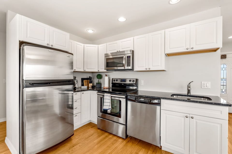 Full kitchen with stainless steel appliances 