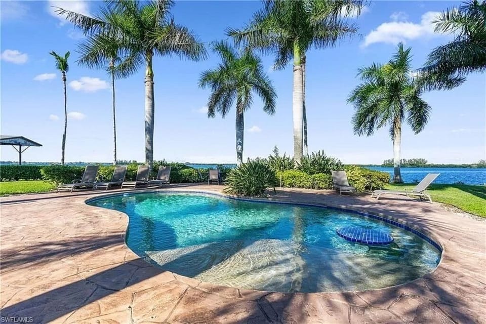 Beautiful Heated private pool with table and large shelf step.

