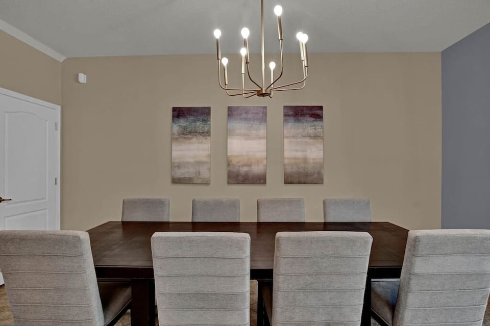 Spacious dining room with modern lighting.
