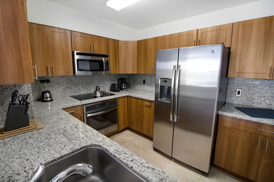Cook effortlessly in a sleek kitchen with stainless appliances.