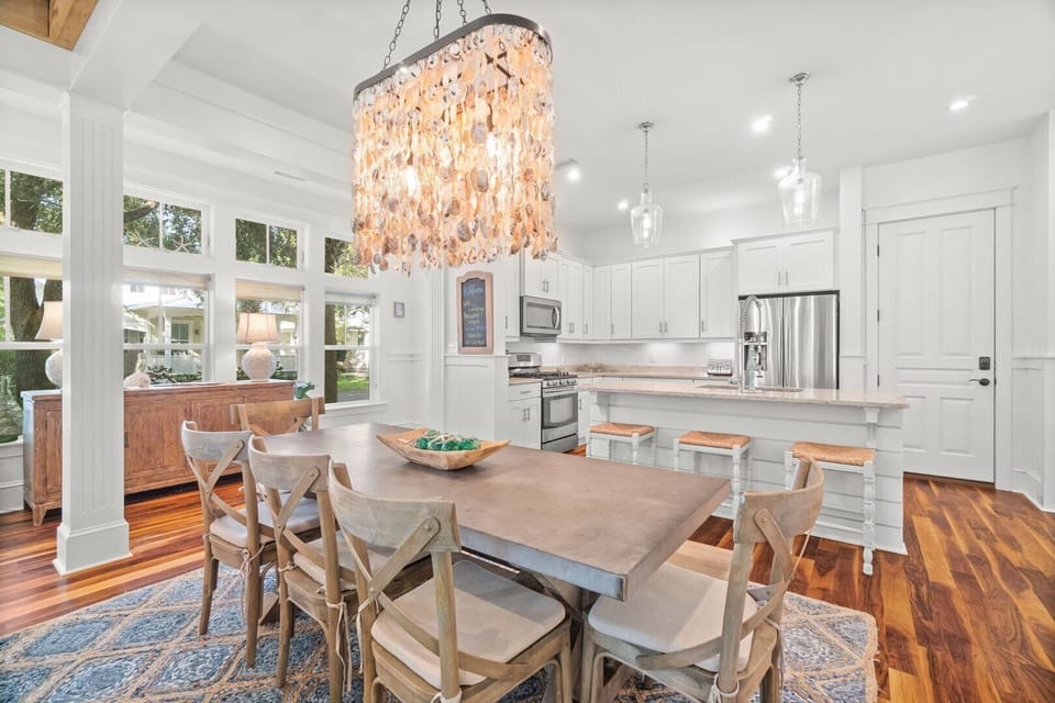 Beautiful oyster shell chandelier is a focal point of the dining and kitchen.