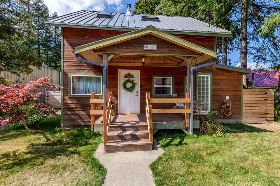 Manicured lawn and parking to the right of the home