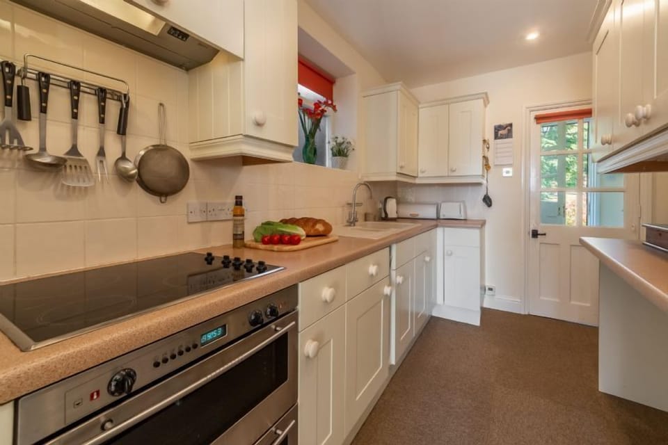 Ground floor: Galley kitchen with electric oven and hob