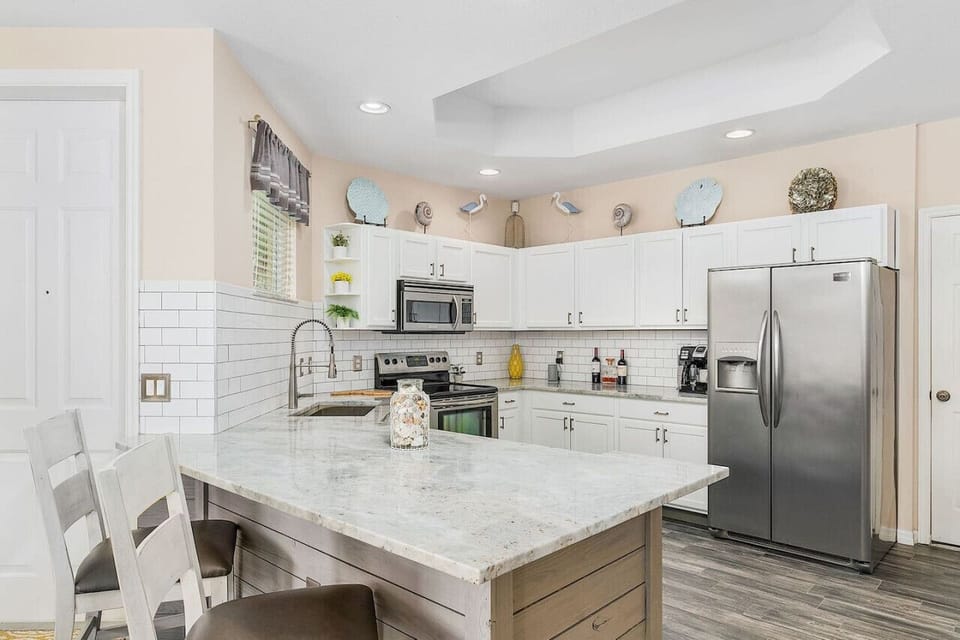 Pull up a chair and share time with your favorite chef in this modern kitchen.