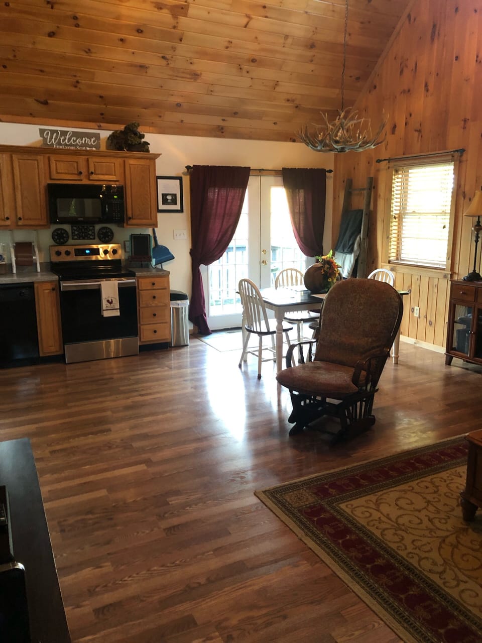 Front room and dining room area with patio on main floor
