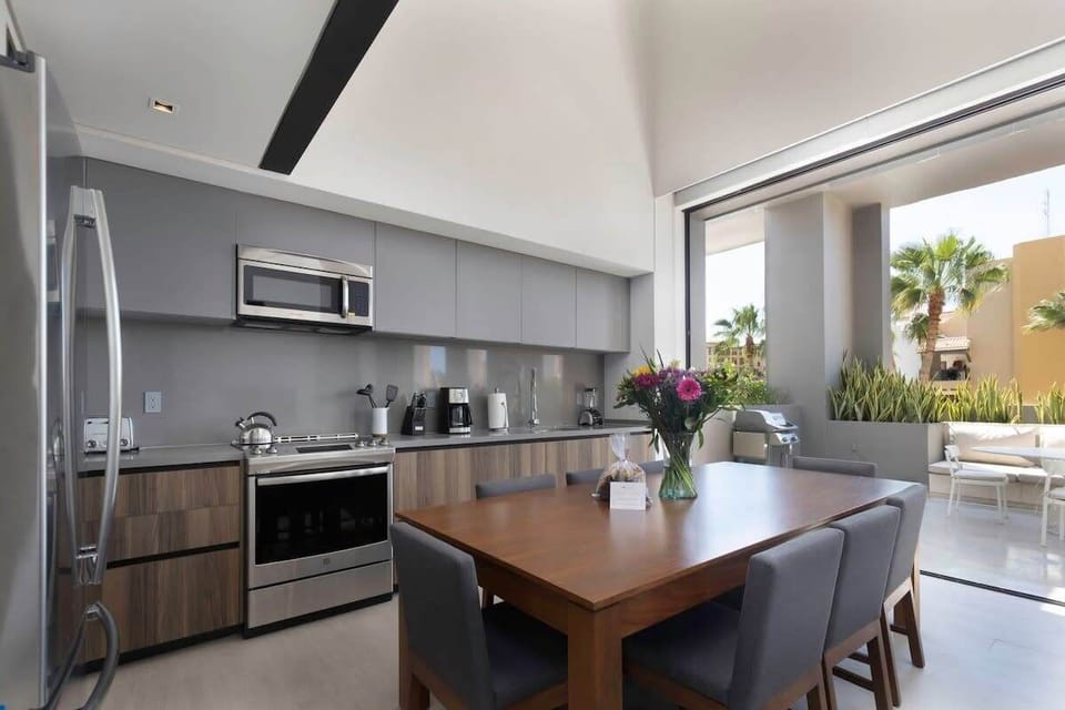 Fully equipped modern kitchen with cookware.