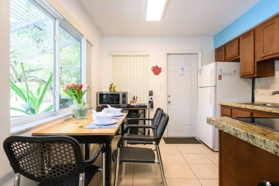 Dining area right off kitchen seats. 