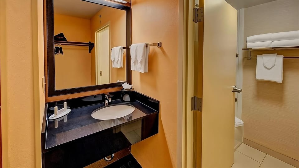 Refresh easily with a clean vanity and bright lighting.