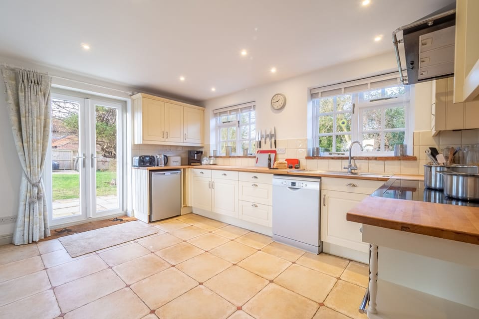 Ground floor: The spacious kitchen has french doors to the garden