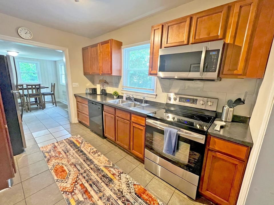 The kitchen is fully equipped with all the necessary supplies and equipment to prepare meals.