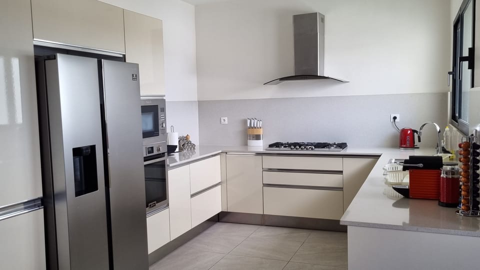 A fully equipped kitchen with fridge, oven Nespresso, microwave, dishwasher, etc