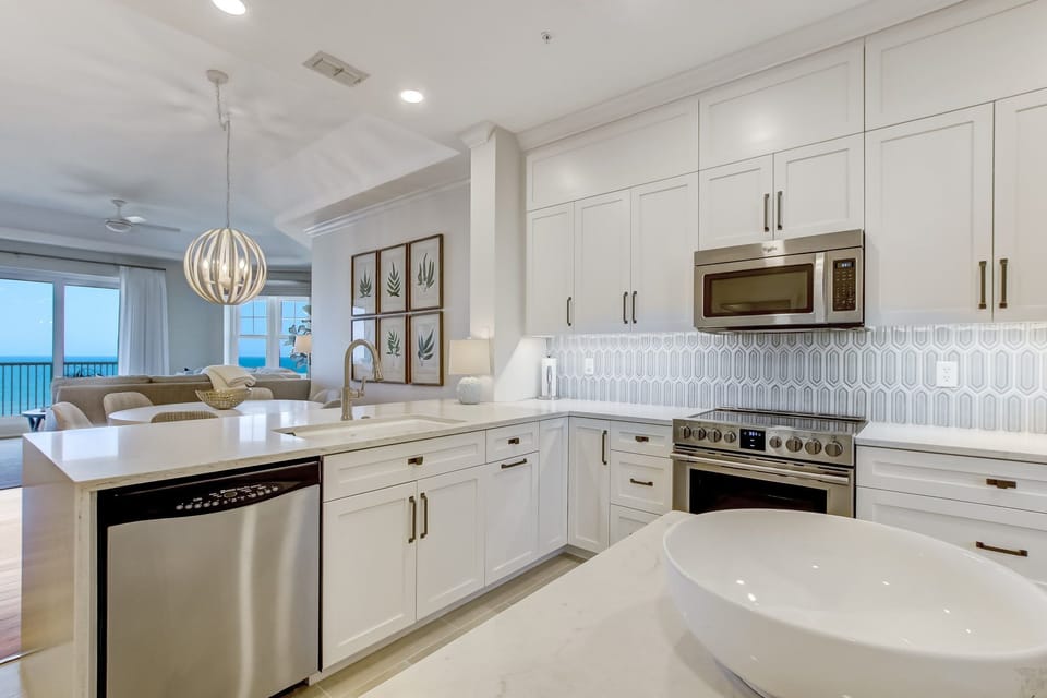 Brand New Kitchen With Quartz Countertops, Stylish Tiled Backsplash, Stainless Steel Appliances and Counter Seating for 2