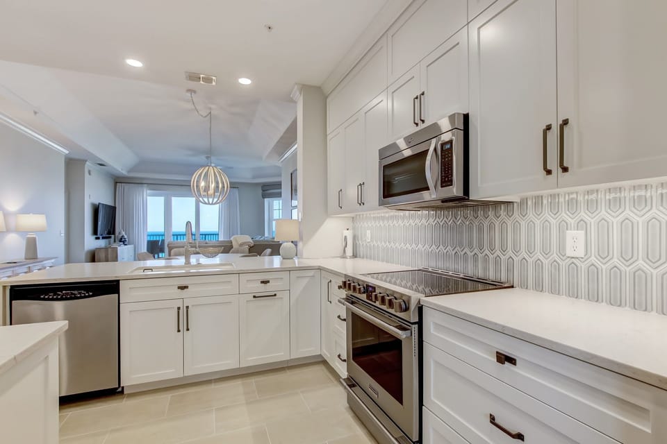 Brand New Kitchen With Quartz Countertops, Stylish Tiled Backsplash and Stainless Steel Appliances
