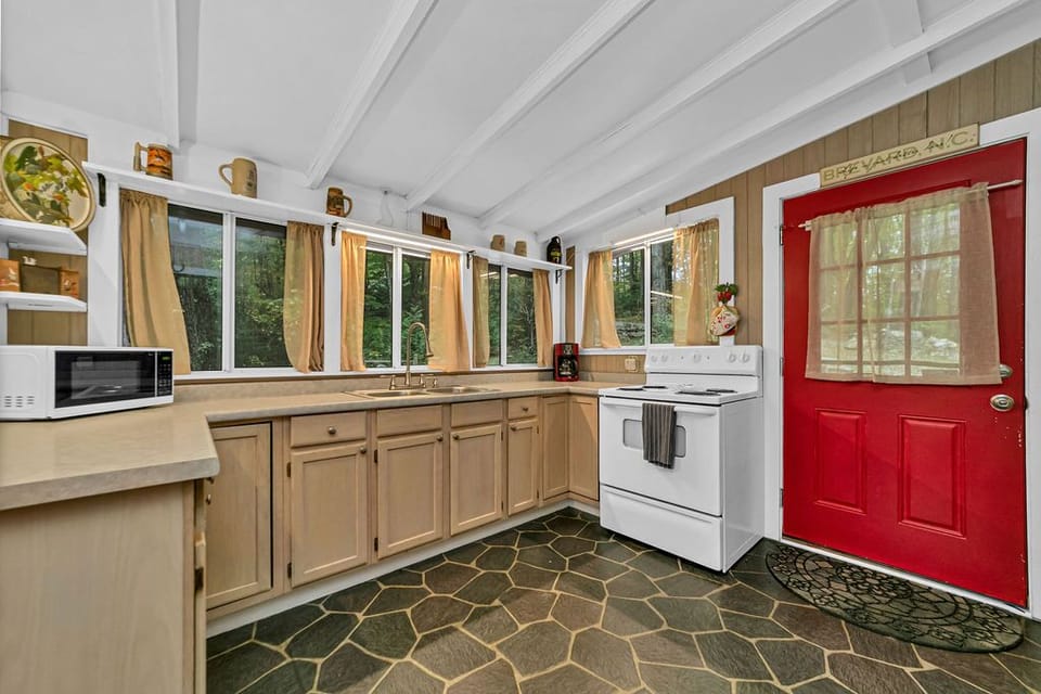 Tons of bright windows in kitchen to prepare meals.