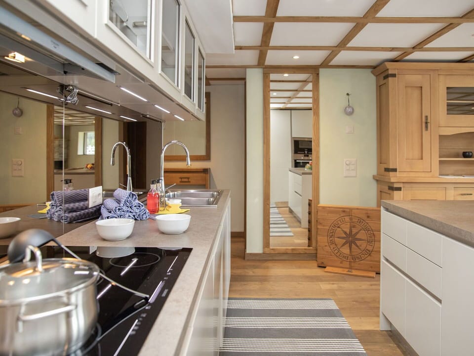 Kitchen, Interior Design, Furniture, Countertop, Flooring, Cabinetry, Wood, Light Fixture, Ceiling, Floor