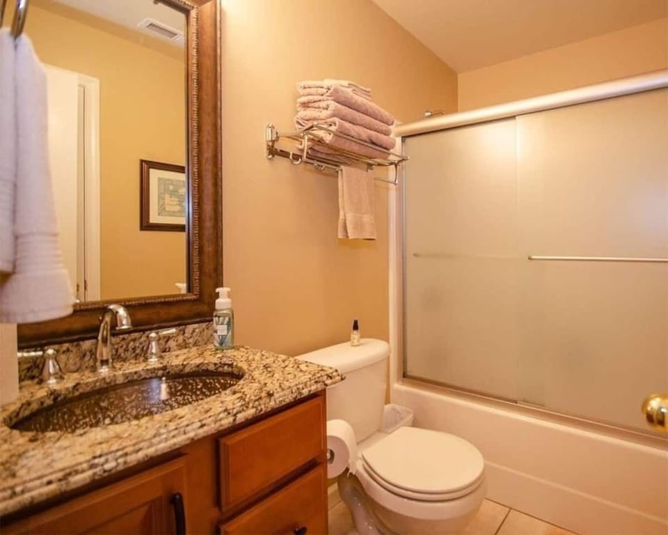 Full bath with access from second room or hallway.