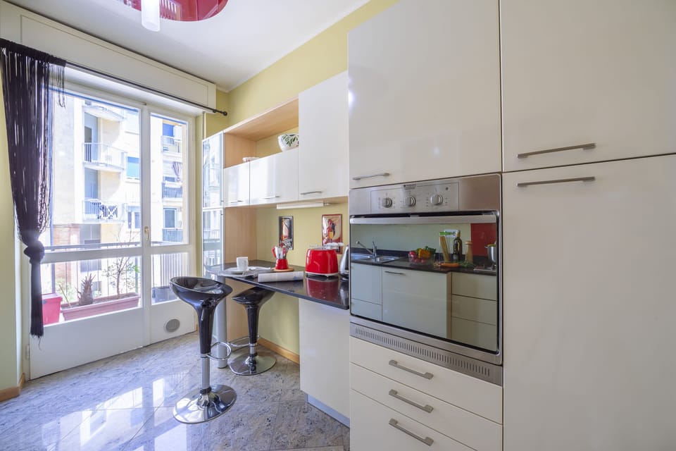 The kitchen with balcony entrance