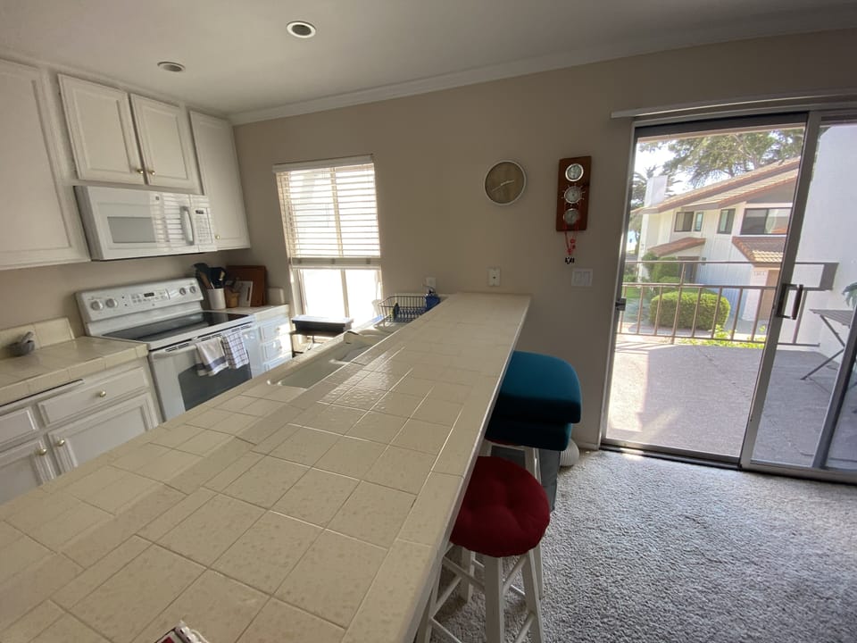Kitchen with adjoining outdoor patio.