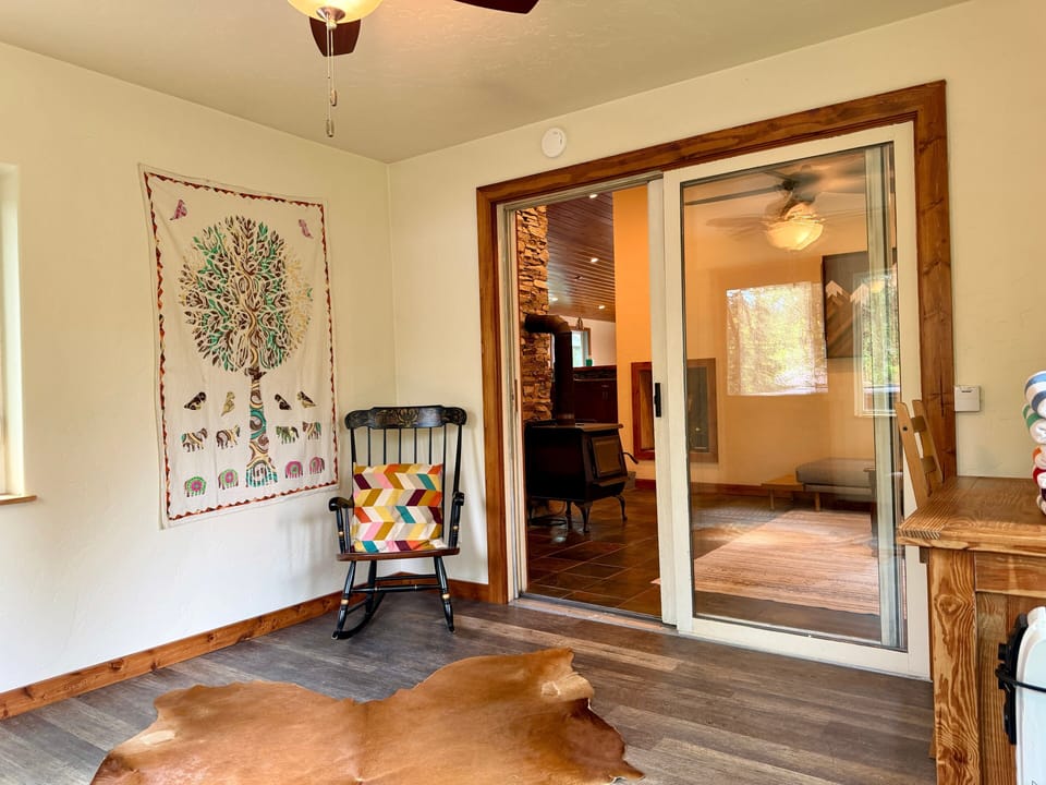 Office Sun room off of living room leading to back deck