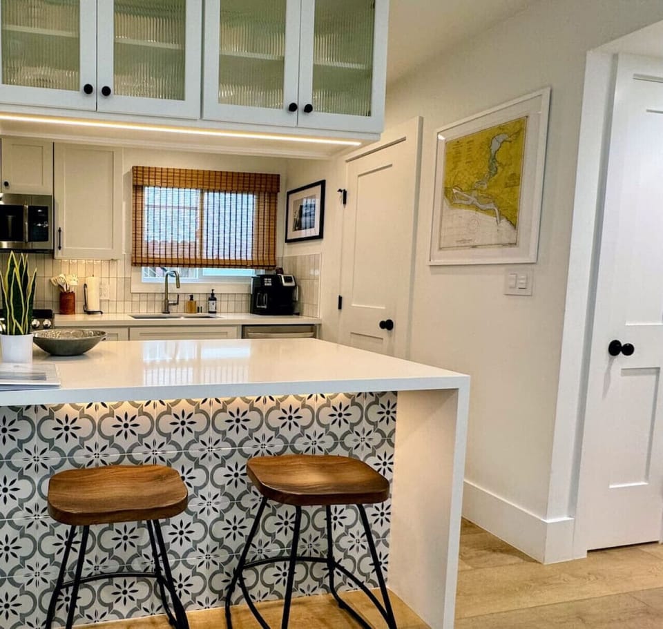 Kitchen Island with seating and beautiful lighting to set the right mood.