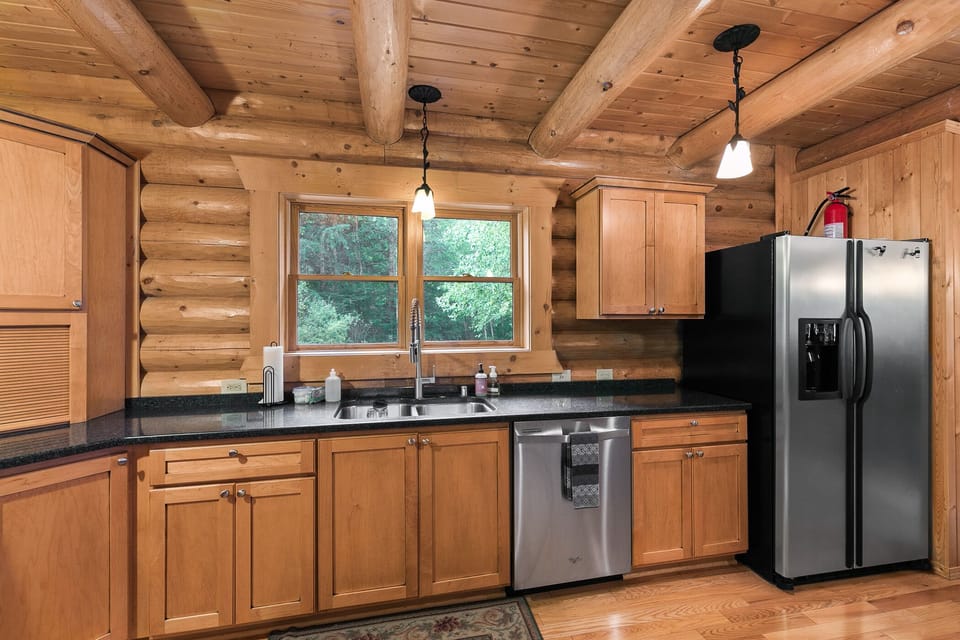 Down the entry hall is the spacious kitchen, leading to the large great room, complete with stainless steel appliances