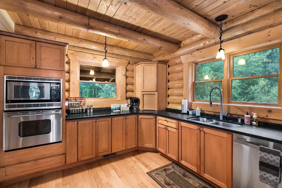 Stainless steel oven, microwave, and dishwasher pictured