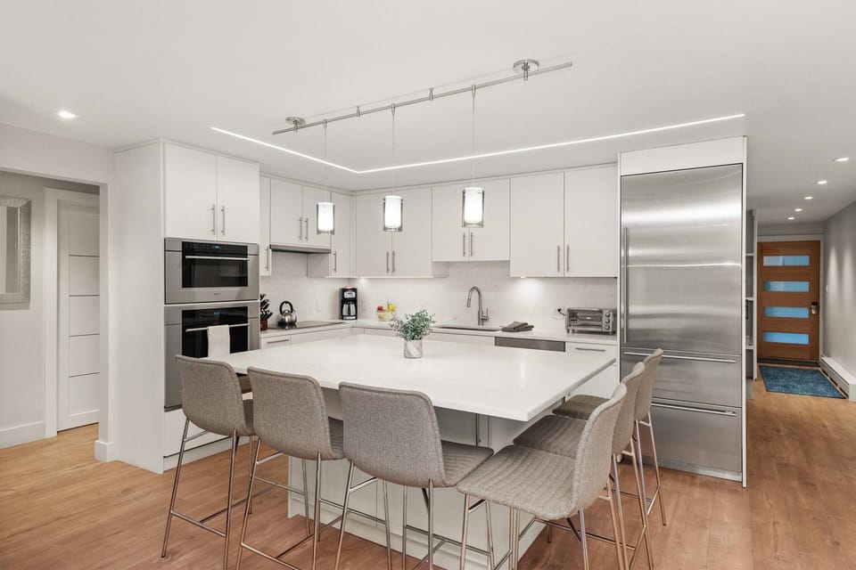 Intentionally designed to be bright and open, the fully stocked kitchen is a welcoming place to spend time during your stay.