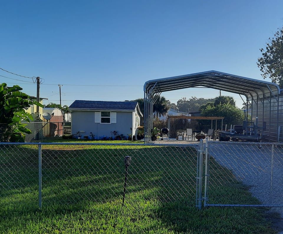You park under the carport. Fenced in yard.