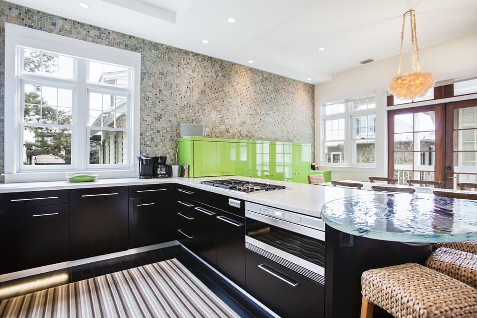 The sleek chef’s kitchen is fitted with top-of-the-line applianc