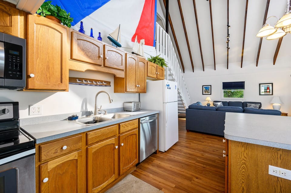 Open Layout with Soaring Ceilings and New Flooring.