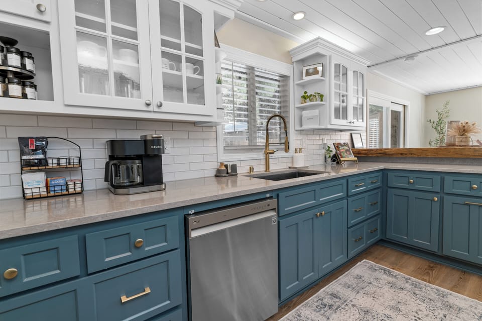 Spacious kitchen connecting to dining room with modern appliances
