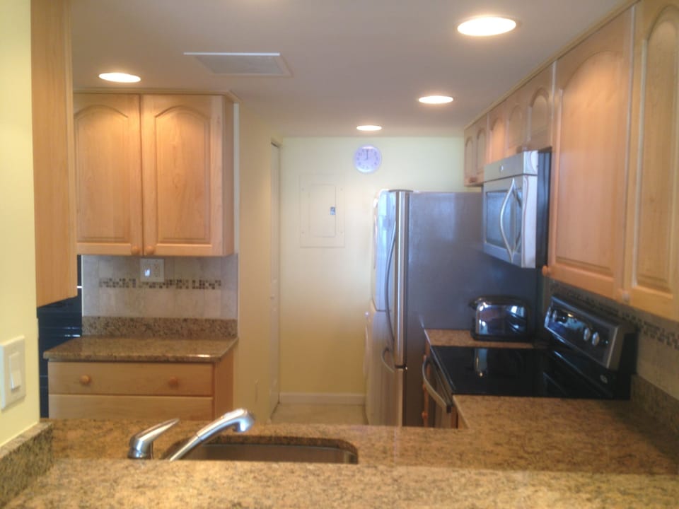 Kitchen with cloths washer dryer