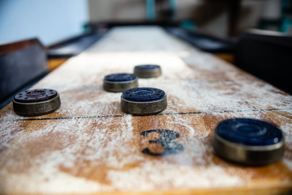 Shuffleboard table in main living area. 