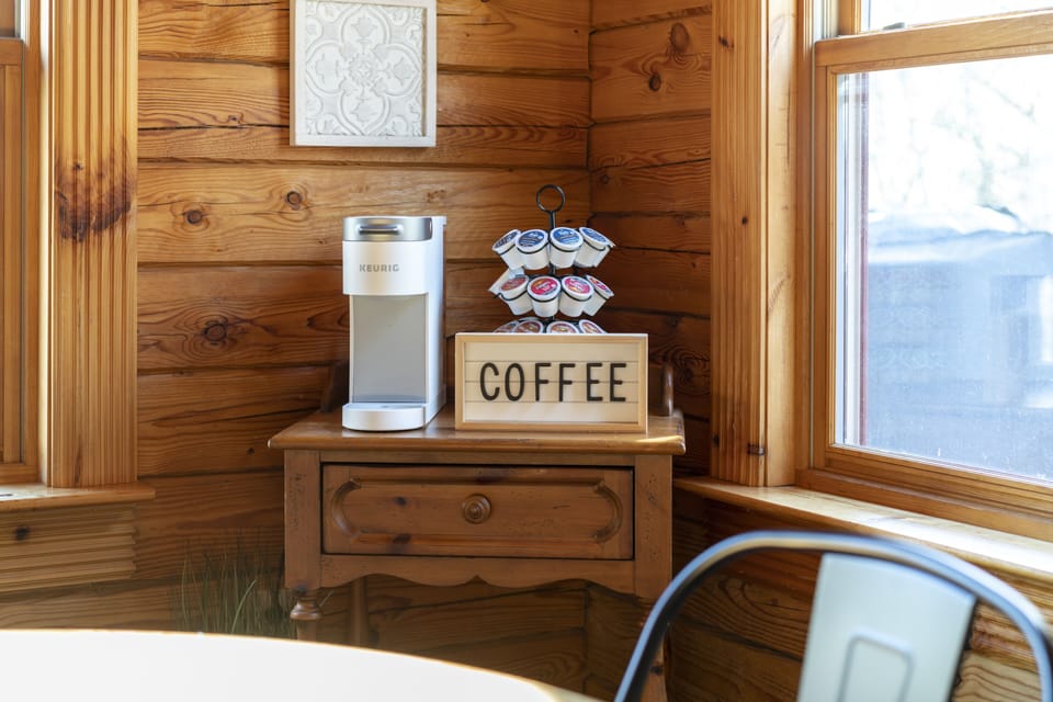 Coffee station with provided k-cups. The kitchen also has a coffee maker