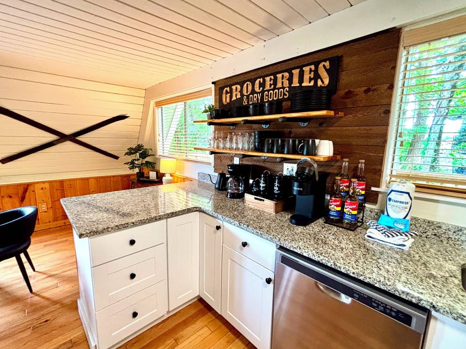 Kitchen in the main level with Keurig coffee maker. 