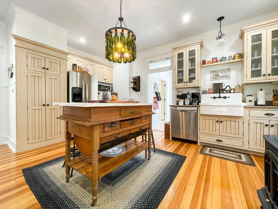 The Bee's Knees (The Beekeeper's Cottage) beautifully detailed full kitchen has everything you need to make your own meals, including place settings, pots and pans, wine glasses, and a regular coffee maker or a Keurig.