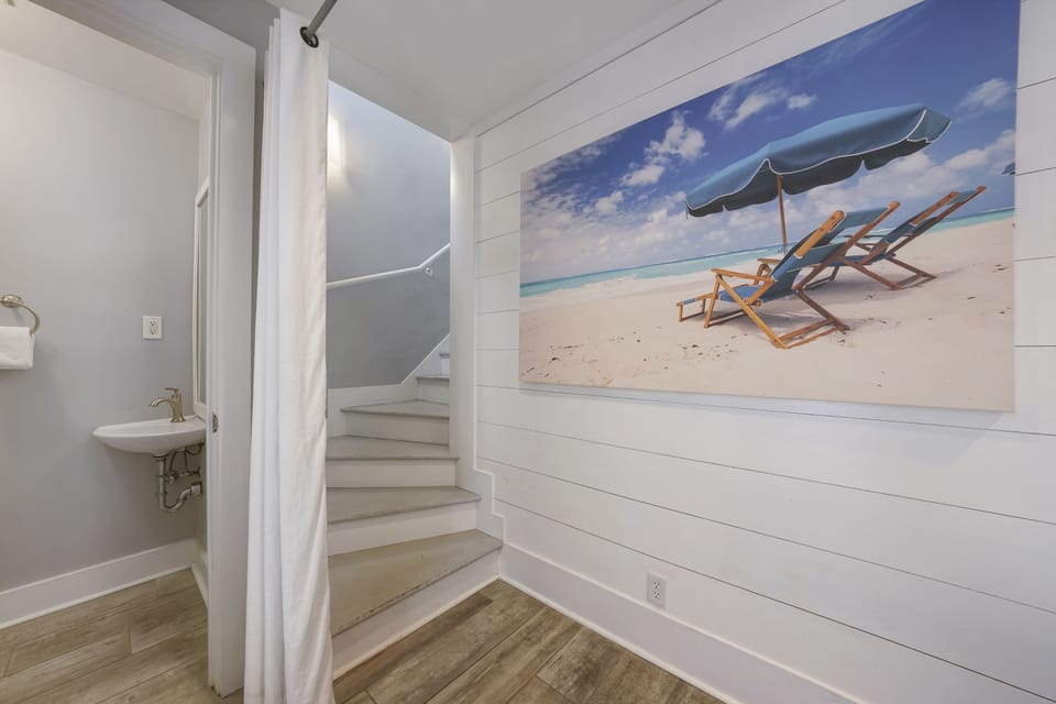 HALF BATH AND STAIRS LEADING TO SECOND FLOOR