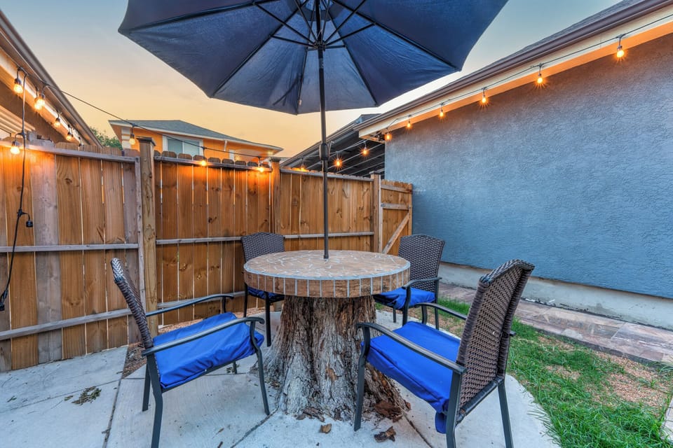 Patio with four seating areas in the backyard