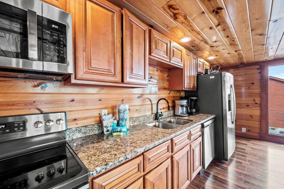 Fully equipped kitchen with modern appliances and rustic charm await your culinary adventures!