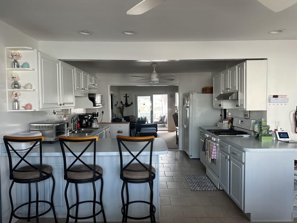 Kitchen area with 3 bar stools