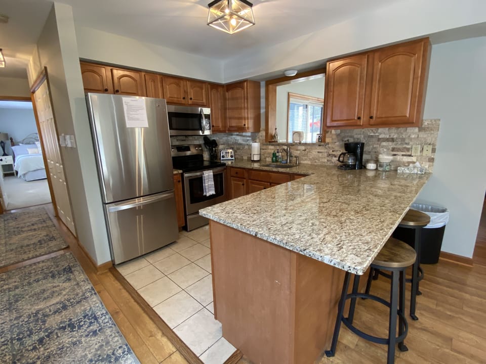 Open Kitchen with Barstool Seating.