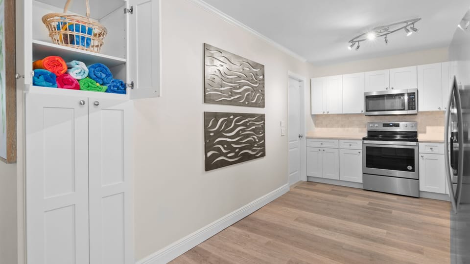 The pantry area has beach towels and beach toys
