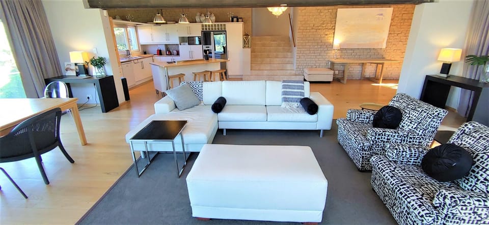 Standing in front of the TV, looking back into the open plan living area