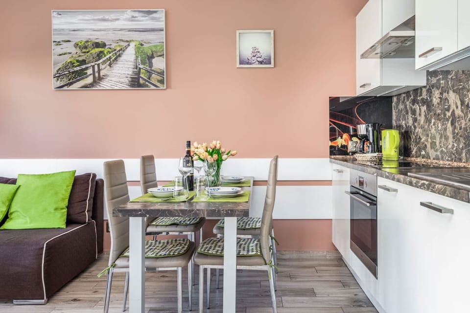 A functional annexe with white furniture and high-quality appliances ensures that home-cooked meals can be prepared.