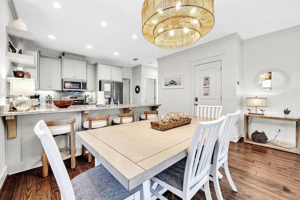 Your open-concept dining and kitchen space features elegant seating and modern appliances for memorable family meals.