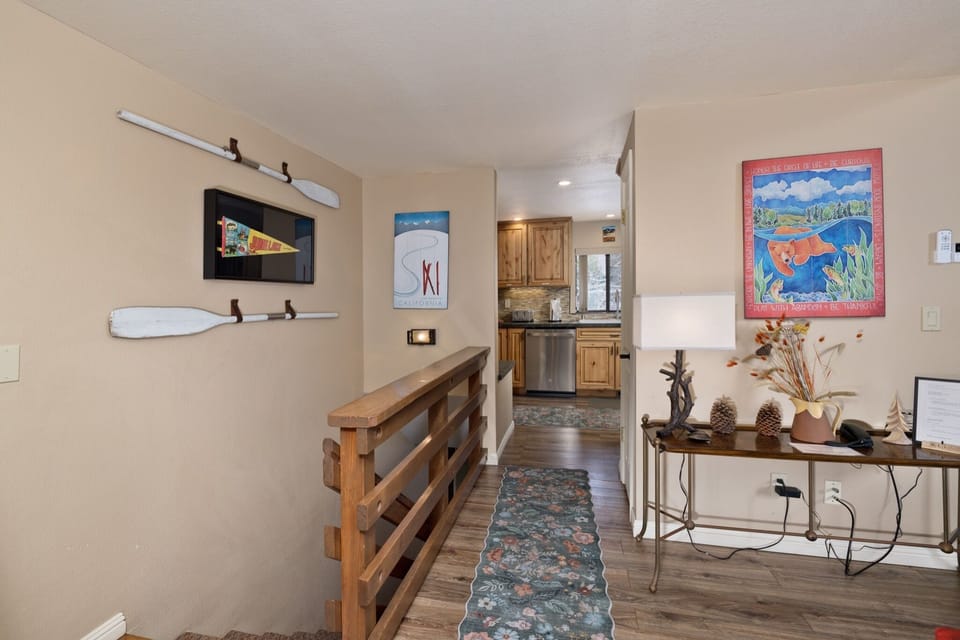 Step inside your home away from home, where charming nautical touches and warm wooden details greet you, inviting you to unwind in comfort after a day exploring the nearby lake.