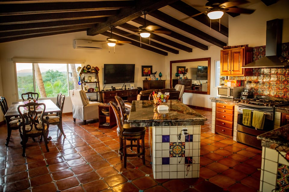 Kitchen space (limited access to guests).  Indoor dining table seats 8.