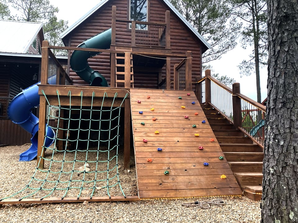 Two-story Kids. play platform featuring 2 7-ft slides