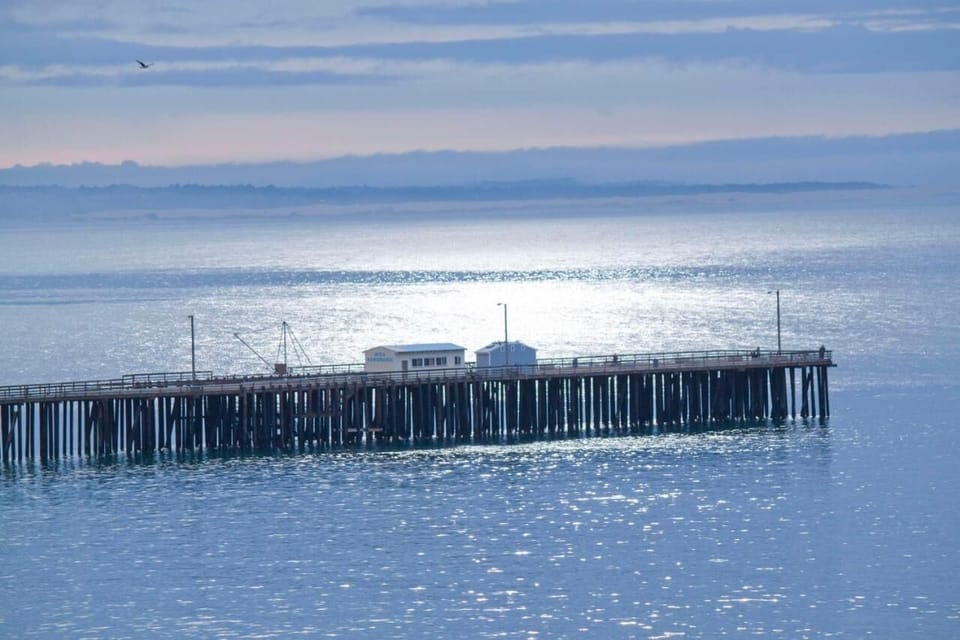 Wander to the pier and watch waves sparkle below.
