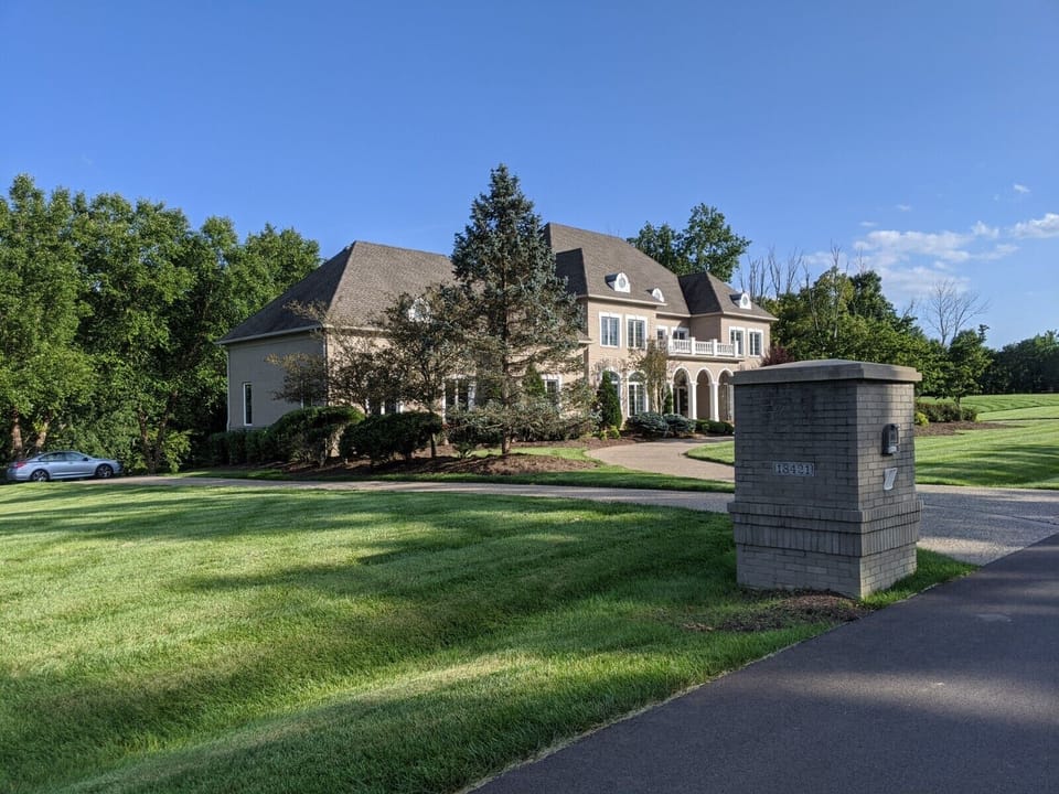 Approach to house  on 5 beautiful, well-maintained acres